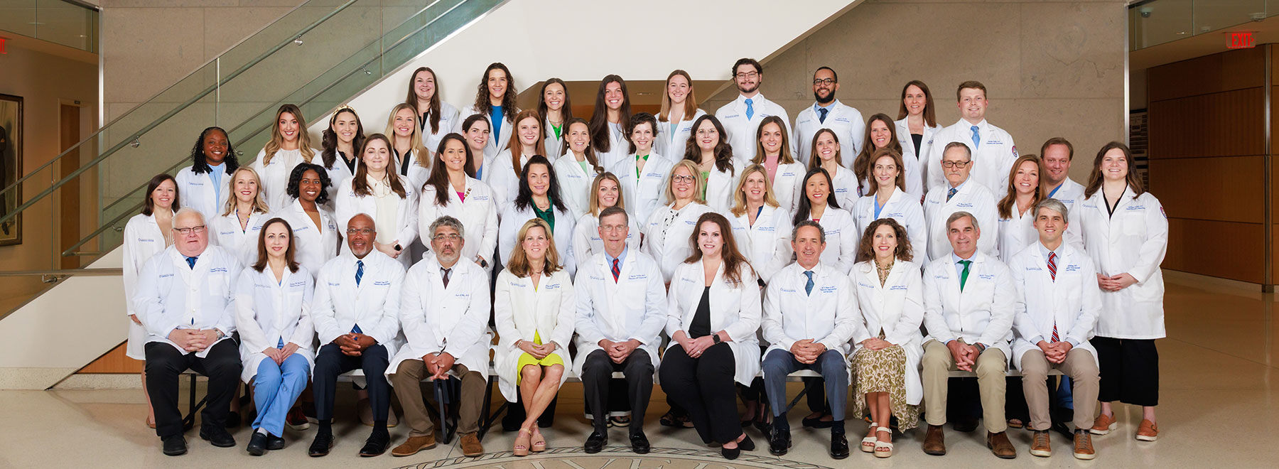 A group photo of the member of Department of Obstetrics and Gynecology poses for a group photo in the lobby of the School of Medicine
